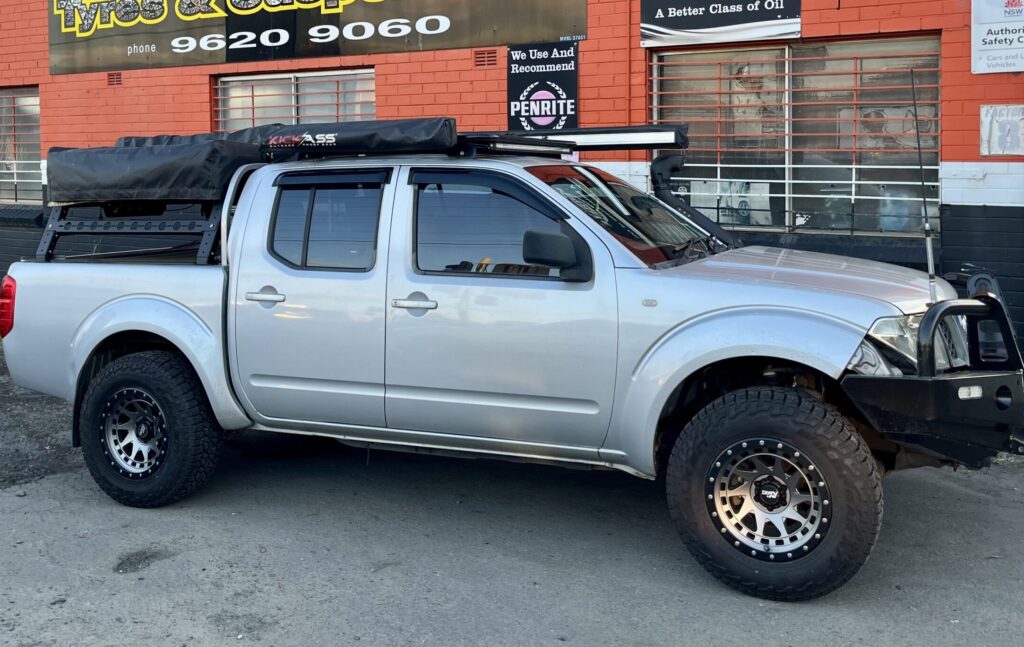 D4o Nissan Navara Fitted With Dirty Life Enigma Pro In Graphite For Unique Tyres Suspension Scaled 2