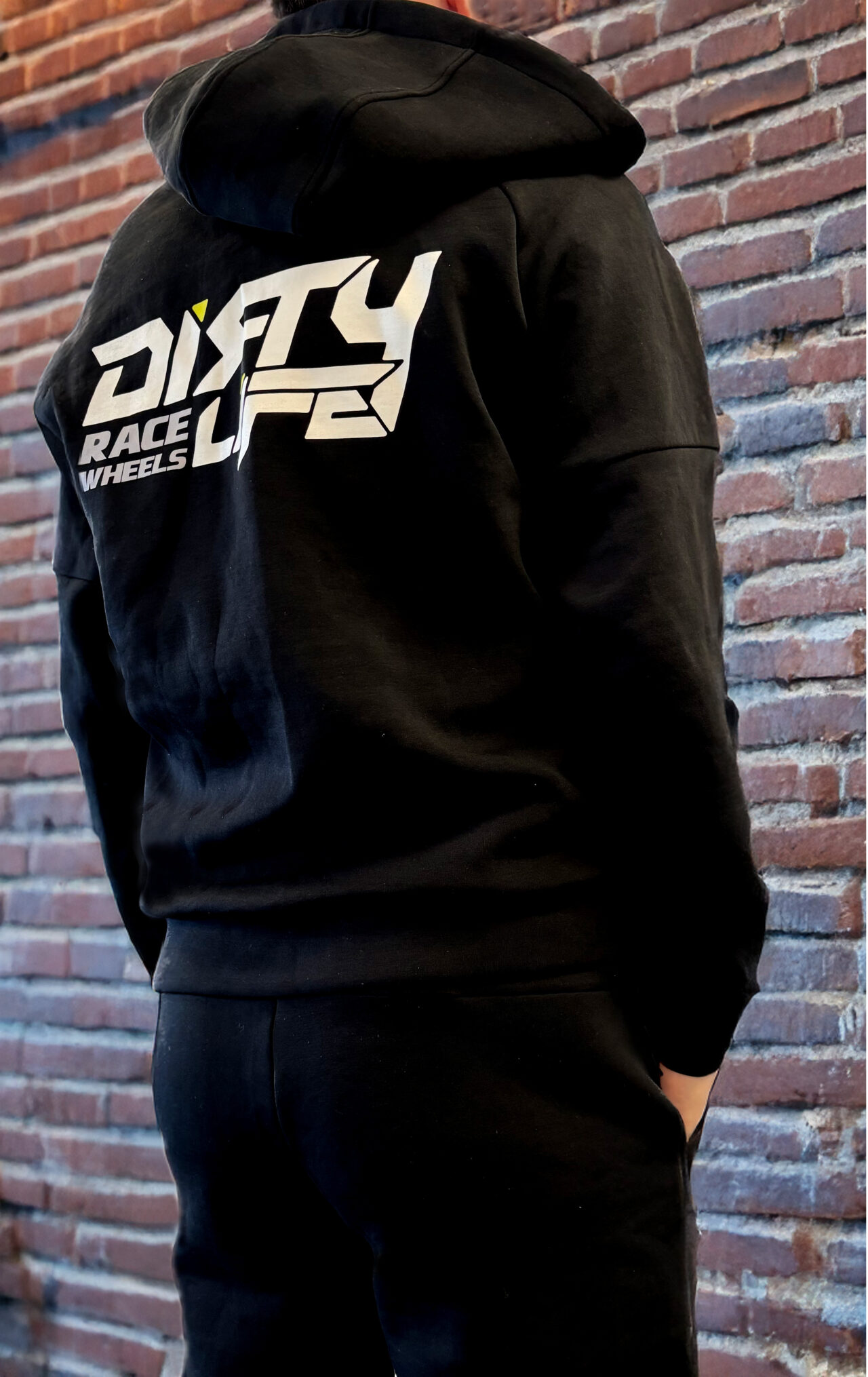 Dirty Life Hoodie Back With Red Brick Wall